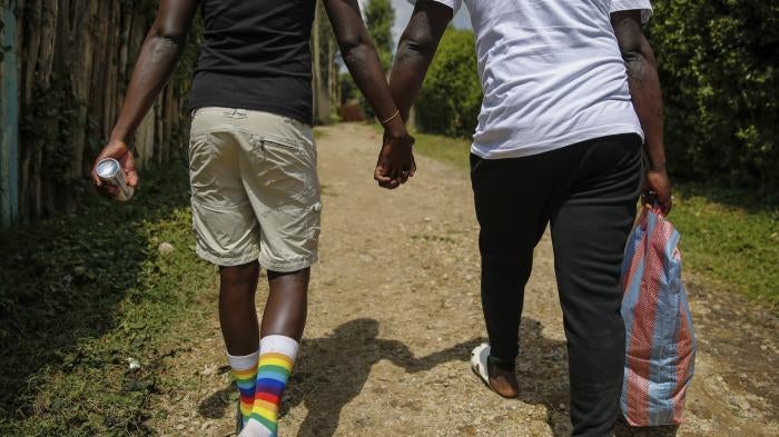 Gay Ugandan refugees who fled from their country to neighboring Kenya, return after shopping for food in Nairobi, Kenya, June 11, 2020.