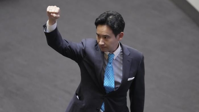 Pita Limjaroenrat, the leader of the Move Forward Party and top winner in May's general election, raises his hand as he leaves Parliament in Bangkok, Thailand, July 19, 2023.