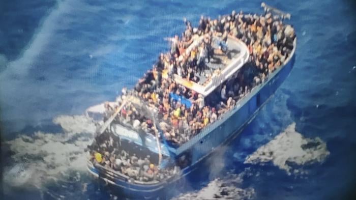 This undated handout image provided by Greece's coast guard on Wednesday, June 14, 2023, shows scores of people covering practically every free stretch of deck on a battered fishing boat that later capsized and sank off southern Greece.(Hellenic Coast Guard via AP)