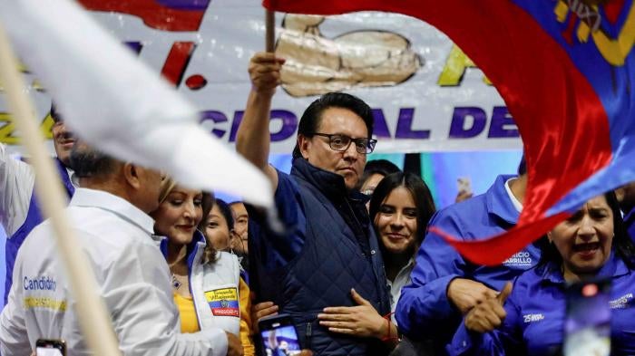 Presidential candidate Fernando Villavicencio waves an Ecuadorean flag during a campaign event at a school before he was shot to death outside the same school in Quito, Ecuador, August 9, 2023.