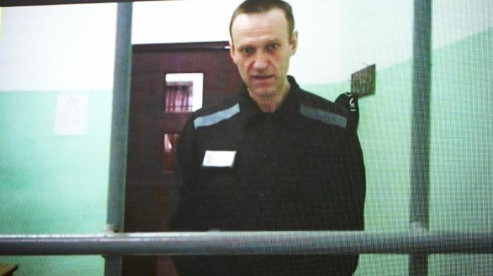  Russian opposition leader Alexei Navalny is seen on a TV screen as he appears in a video link provided by the Russian Federal Penitentiary Service from the colony in Melekhovo, Vladimir region, during a hearing at the Russian Supreme Court in Moscow, Russia,  June 22, 2023.