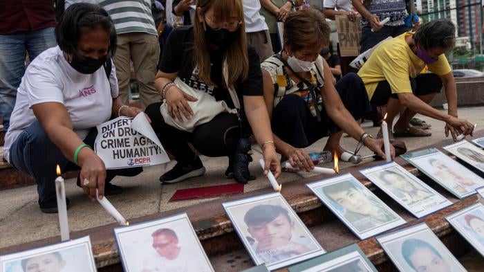Relatives of “drug war” victims light candles after the International Criminal Court allowed the ICC prosecutor to resume his investigation into alleged crimes against humanity in the Philippines, Quezon City, July 18, 2023. 