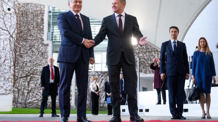 German Chancellor Olaf Scholz (R) welcomes Shavkat Mirsiyoyev, President of Uzbekistan, in front of the Chancellor's Office in Berlin, Germany, May 2, 2023.
