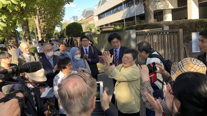 Eiko Kawasaki and other plaintiffs celebrate outside a Tokyo courthouse after a high court found the North Korean government liable for human rights violations against Korean and Japanese citizens it had lured to North Korea through its “Paradise on Earth Campaign,” Tokyo, Japan, October 30, 2023.