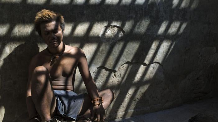 This man with a real or perceived psychosocial disability is one of the residents at Marsiyo’s House, a private family-run social care facility in Kebumen, Central Java, Indonesia. The crumbling shelter where he is chained leaves him exposed to hours of direct sunlight and constant dust.