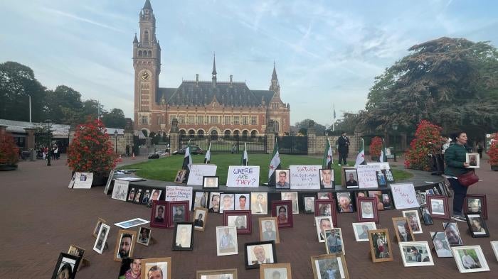 Photos of Syrians who have been detained or disappeared set up by their relatives, as part of a protest in front of the International Court of Justice in The Hague, Netherlands, on October 10, 2023.