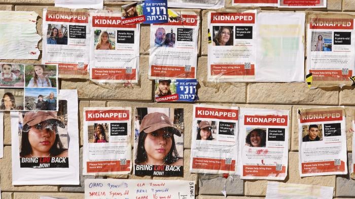 Photographs of Israelis taken as hostages during an October 7 attack by Hamas-led fighters, at a protest demanding their release, outside the HaKirya military base in Tel Aviv, Israel, on October 17, 2023. 