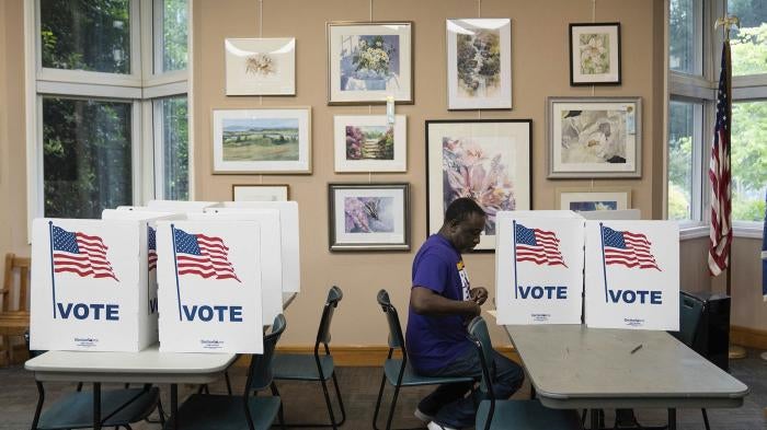 A voter filling out a ballot at the Green Spring Gardens polling station in Lincolnia, Virginia, US, June 20, 2023. 
