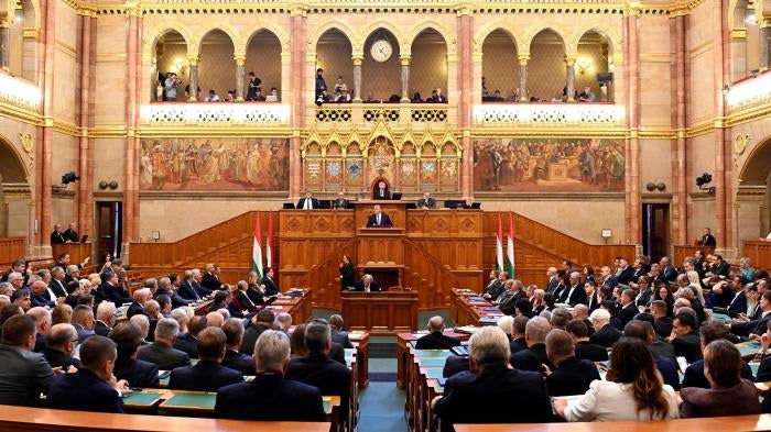 Hungarian Prime Minister Viktor Orban, center, delivers his address on the opening day of the parliament's autumn session 