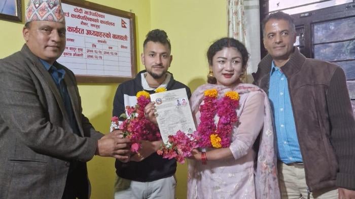 Surendra Pandey and Maya Gurung register their marriage with authorities in Dordi, a municipality in the bride’s home district of Lamjung, Nepal, November 29, 2023.
