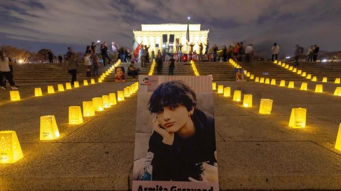 A photo of Armita Geravand,  a 16-year-old Iranian student who died after falling into a coma following an encounter with authorities in Iran,  is displayed in front of the Lincoln Memorial in Washington, DC, October 28, 2023.