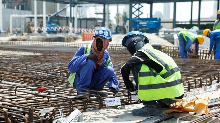 Workers at a construction site as the UAE implements a midday work break from 12.30pm to 3.30pm for laborers to help cope with the heat, Dubai, United Arab Emirates, August 15, 2023.