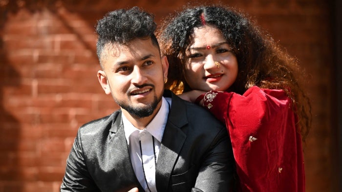 An LGBTQ couple, Surendra Pandey (left) and Maya Gurung, a transgender woman, pose for pictures after obtaining their marriage certificate in Kathmandu, Nepal, December 1, 2023.