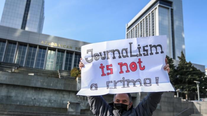 Ulvi Hasanli, director of "Abzas Media" online publication is seen during a rally of journalists against a new media bill, in front of the Parliament building in Baku, Azerbaijan, December 28, 2021. 