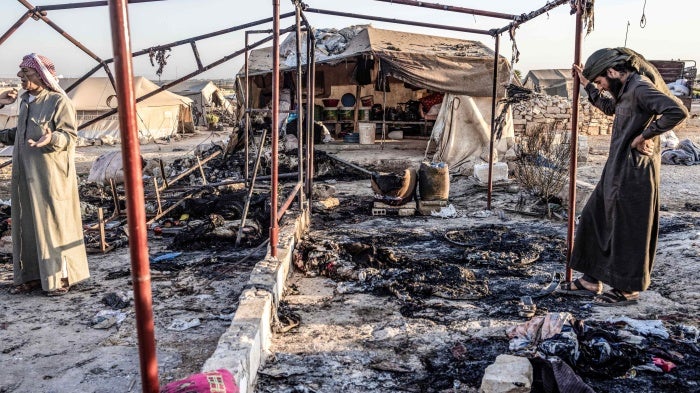 A destroyed tent can be seen as a result of a missile attack targeted a camp for displaced people on the outskirts of Idlib city by the Syrian government. © 2023 Anas Alkharboutli/picture-alliance/dpa/AP Images