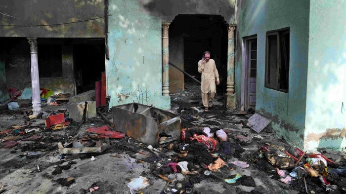 A Christian man looks at a home vandalized by a Muslim mob in Jaranwala, Pakistan, August 17, 2023.