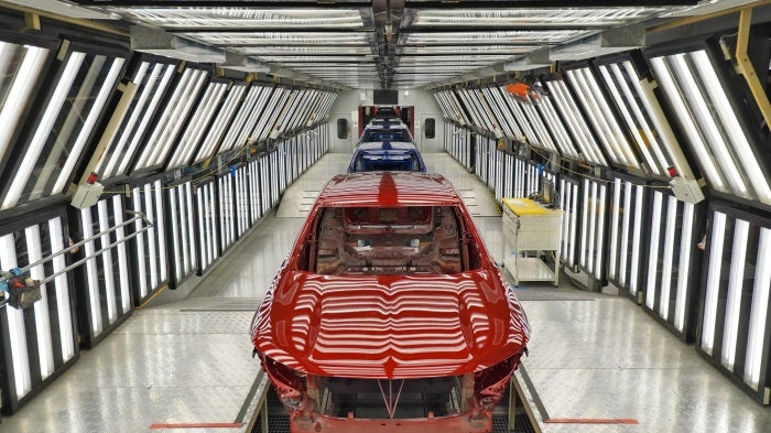 Cars are delivered on a production line
