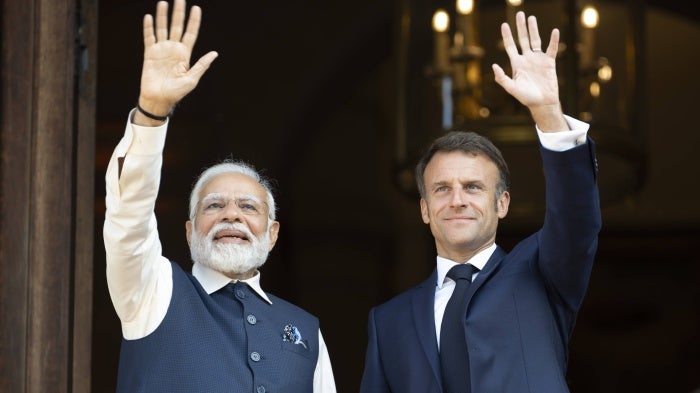 India's Prime Minister Narendra Modi (L) and France's President Emmanuel Macron attend a meeting at the Ministry of Foreign Affairs in Paris on July 14, 2023.