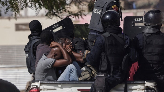 Detained demonstrators on a police pick up during a protest against the postponement of the February 25, 2024 presidential election, in Dakar, Senegal, on  February 9, 2024.