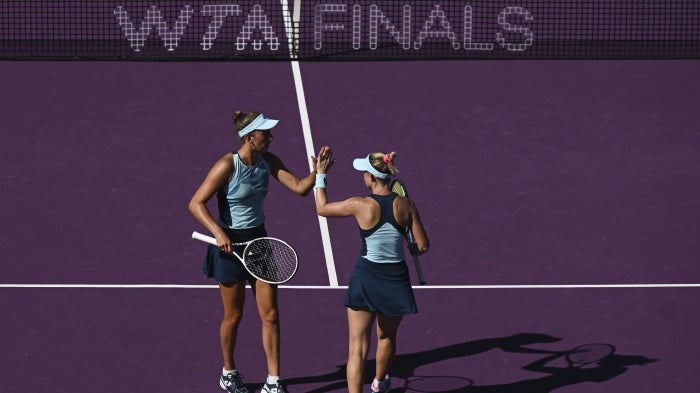 Storm Hunter of Australia and Elise Mertens of Belgium during a match during the GNP Seguros Women's Tennis Association Finals in Cancun, Mexico, October 30, 2023. 