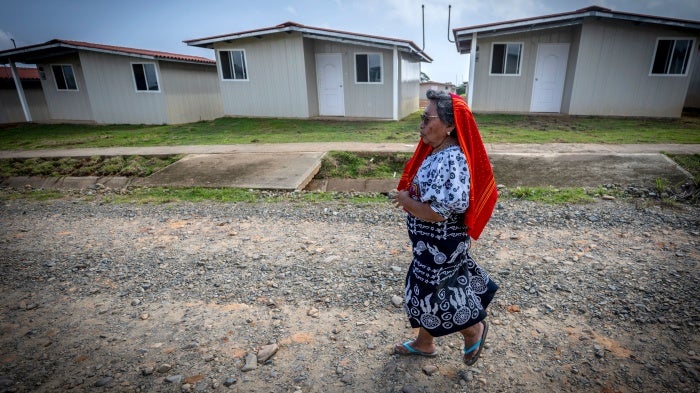 A Guna Indigenous woman walks in Isber Yala, the site where her new, safer house was built in Guna Yala Comarca, Panama, August 30, 2023. 