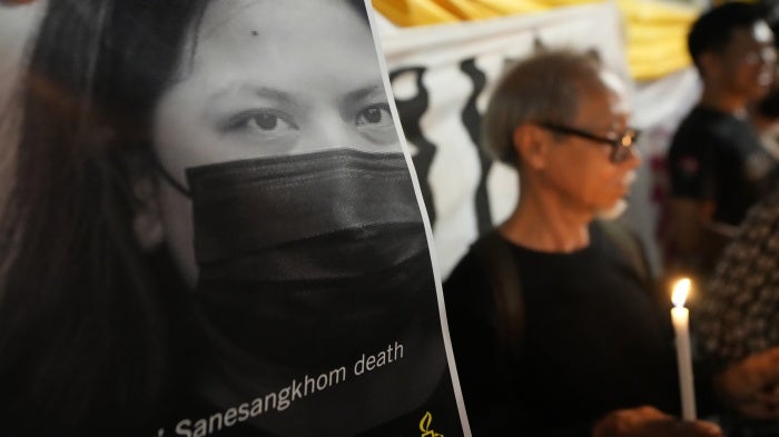 Thai activists hold a portrait of Netiporn “Bung” Sanesangkhom outside of a criminal court in Bangkok, Thailand, on May 14, 2024.