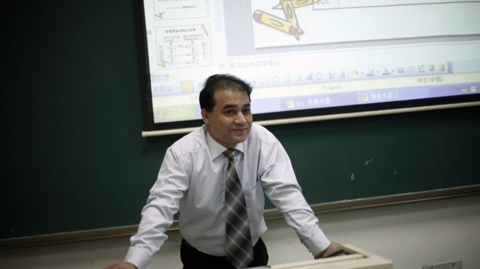 Economist Ilham Tohti, from China's predominantly Muslim Xinjiang region, speaks to students at the Central Nationalities University in Beijing, China, December 1, 2009.