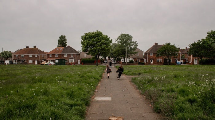 Children play in a park on a housing estate in Redcar, Teesside, May 17, 2023.