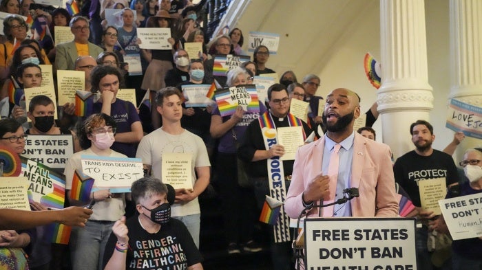 Texas State Rep. Christian Manuel joins LGBTQ+ activists to protest Senate Bill 14, which bans gender-affirming medical care for transgender youth, at the Texas State Capitol, in Austin, May 12, 2023.
