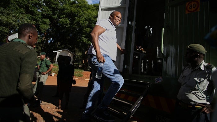 Job Sikhala, former legislator and member of the Zimbabwean opposition party Citizens Coalition for Change, climbs into a prison truck at the magistrates court in Harare, Zimbabwe, January 24, 2024.
