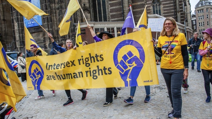 Marchers carry a banner in support of intersex rights in Amsterdam, Netherlands.