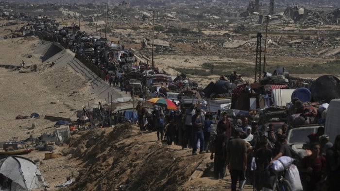 Displaced Palestinians flee northern Gaza along the coastal road toward the south, after Israel's military escalated its assault on Gaza City and warned residents to leave, September 16, 2025.