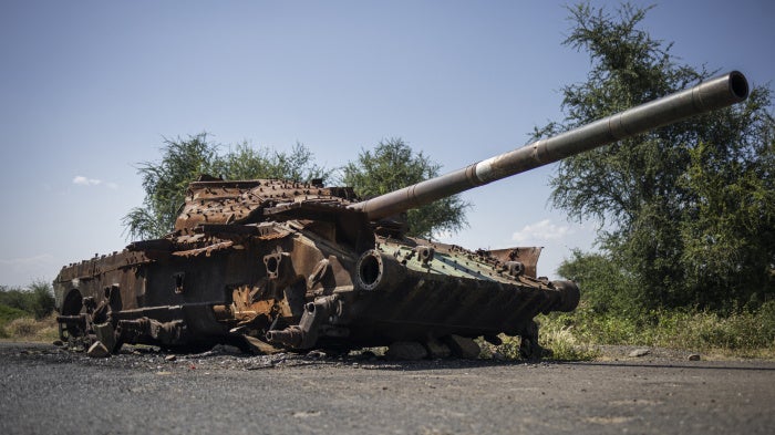 A charred T-72 tank lay on the road that connects Shiraro to Shire in Ethiopia's Tigray region, October 12, 2024. 