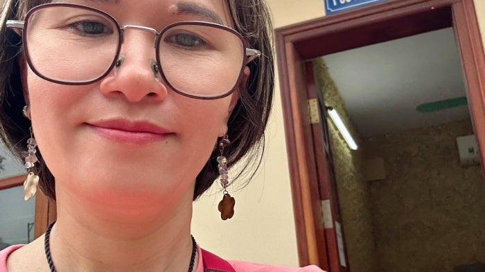 Hoang Thi Hong Thai outside the police interrogation room in Hanoi, April 2025.