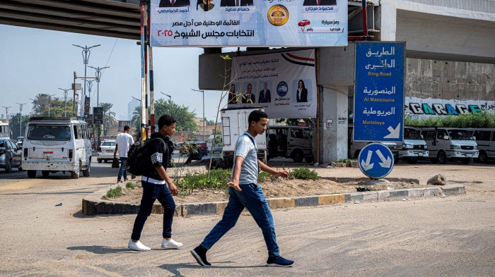 An electoral banner showing the candidates running for Egypt's National Front Party in Senate elections in Giza, in July 2025.