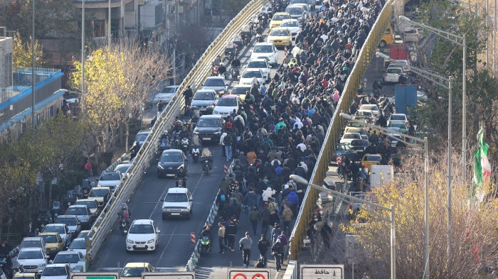 Protesters march in downtown Tehran, Iran, on December 29, 2025. 