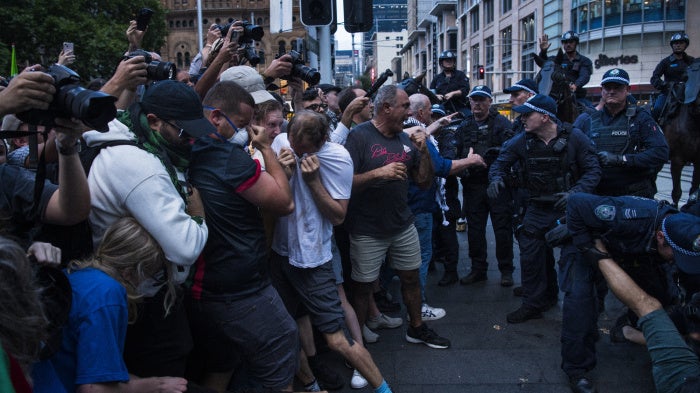 Police confronting a group of protesters