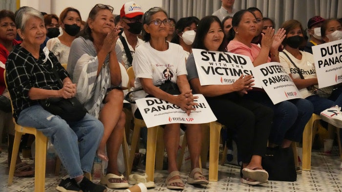 Families of victims of the “war on drugs” watch a live stream 