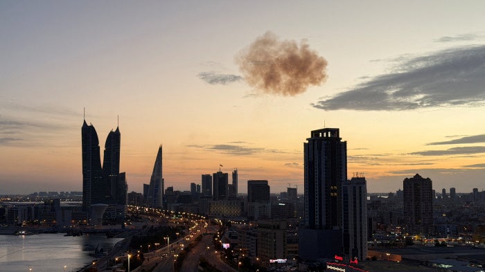 Smoke rises after an Iranian drone was intercepted over the Bahrain Financial Harbour towers, which houses the Israeli embassy, amid the US-Israel conflict with Iran, in Manama, Bahrain, March 6, 2026.