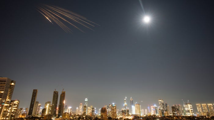 Missiles launched from Iran carrying suspected cluster munitions streak across the sky over central Israel, March 5, 2026.