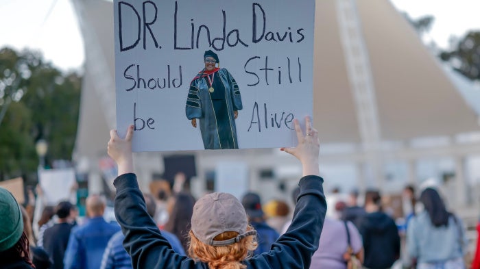 People protest at Forsyth Park after the death of teacher Linda Davis, who was killed in a vehicle collision with a man fleeing from US Immigration and Customs Enforcement (ICE) agents in Savannah, Georgia, US, February 17, 2026. 