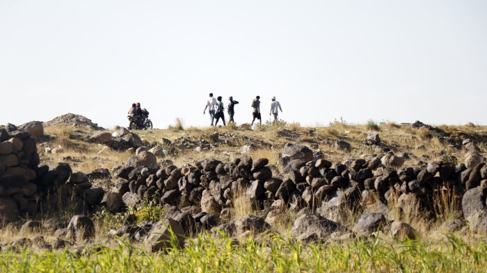 Ethiopian migrants seeking asylum or a better life in Gulf States, walk along a highway to Saadah province to cross into Saudi Arabia, on August 23, 2023 on the outskirts of Sana'a, Yemen.