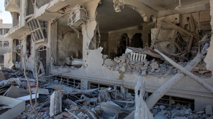 Debris tumbles from a residential building hit in an airstrike  on March 30, 2026 in Tehran, Iran. 