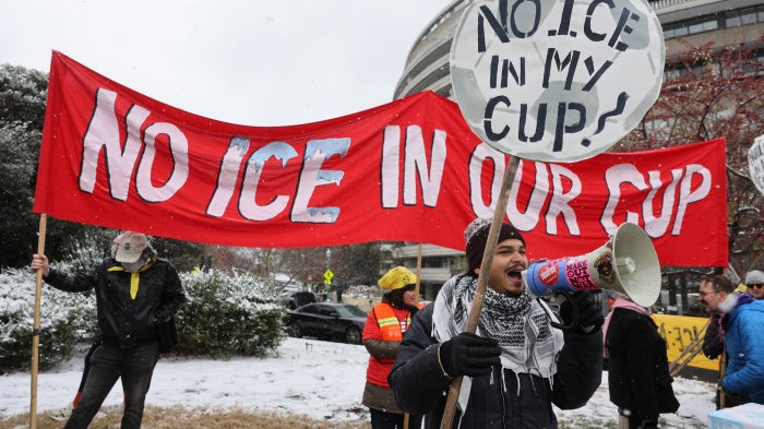 Demonstrators against the FIFA 2026 World Cup draw take part in a protest called "No ICE in my Cup!", in Washington, December 5, 2025.