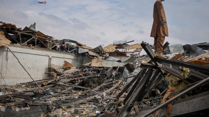 A man stands on the debris at the site of a drug rehabilitation hospital destroyed in what the Taliban said was a Pakistani airstrike on Kabul, Afghanistan, March 17, 2026.
