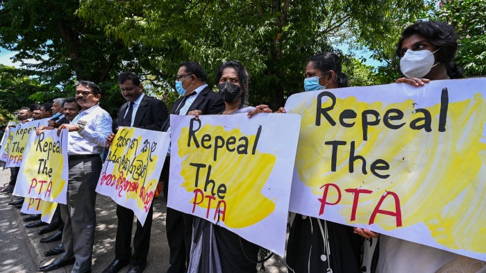 Lawyers hold signs during a protest against the Prevention of Terrorism Act. Colombo, Sri Lanka, September 23, 2022. 