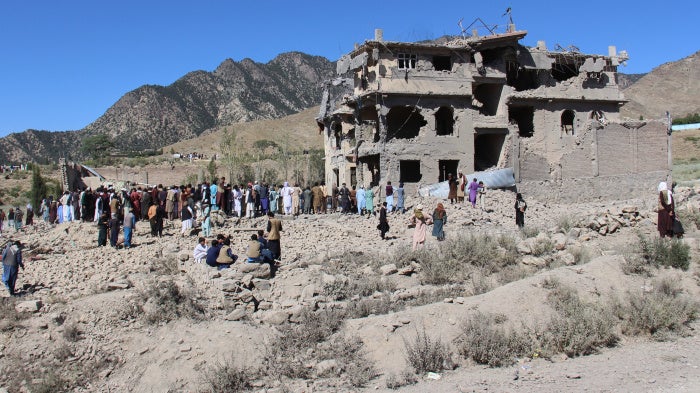 Residents walk through the rubble from Pakistani airstrikes that killed civilians in the village of Mandokhail, Chamkani district, Afghanistan, June 29, 2026.