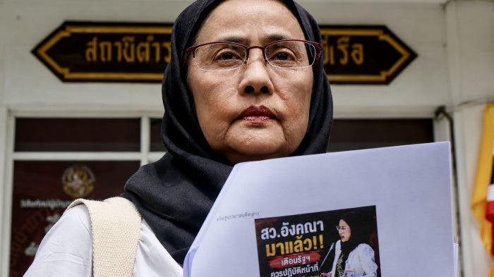 Angkhana Neelapaijit reports online attacks against her at Bang Yi Reua police station in Bangkok, Thailand, July 31, 2026.
