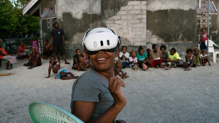 A resident of the Ngongosila community in Malaita Province, Solomon Islands views Virtual Reality content during a demo session.