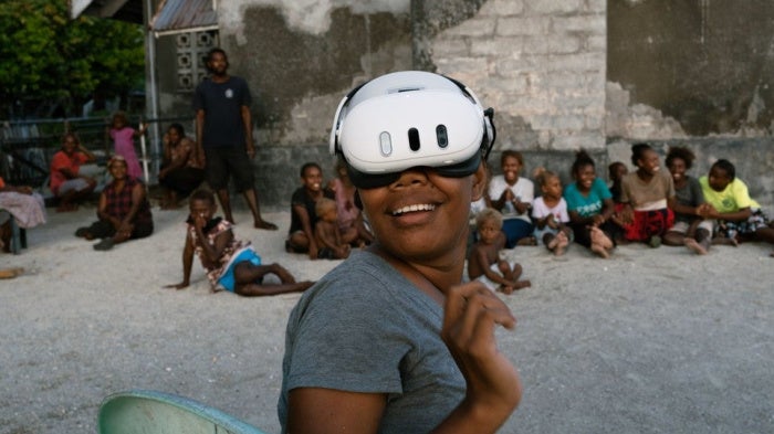A resident of the Ngongosila community in Malaita Province, Solomon Islands views Virtual Reality content during a demo session.